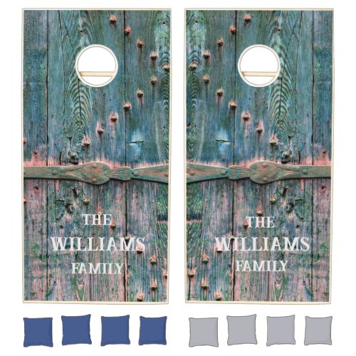 Rustic wooden gate and iron in blue custom cornhole set