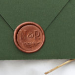 Rustic Wreath Custom Couple's Initials Wedding Wax Seal Sticker<br><div class="desc">A rustic wax seal for couples. This design features two initials in bold serif capitals separated by a cute ampersand. There is a hand-drawn botanical leaf curved underneath. A wax sticker is the perfect finishing touch for wedding invitation suites, favors, thank yous, gift wrap, and holiday cards. Save yourself the...</div>