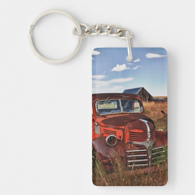 Rusting orange Dodge truck with abandoned farm Keychain (Front)