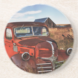 Rusting orange Dodge truck with abandoned farm Sandstone Coaster