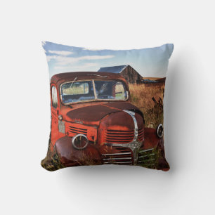 Rusting orange Dodge truck with abandoned farm Throw Pillow