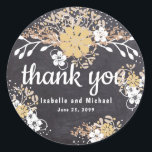 Rustsic White Gold Floral Chalkboard Thank You Classic Round Sticker<br><div class="desc">A modern vibe for a traditional country style. It starts with the chalkboard and then adds golden yellow and tiny white flowers. There's a variety of white, soft pink and brown vines and leaves.The assymetrical floral arrangement makes it modern and boho chic. Thank you, your names and date are all...</div>