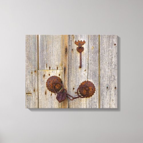 Rusty vintage old iron padlock on a wooden door __ canvas print