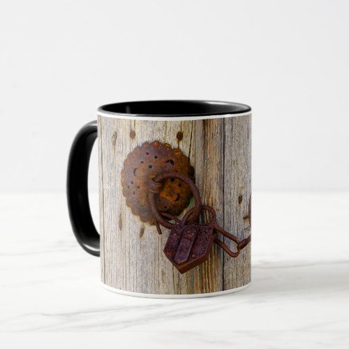 Rusty vintage old iron padlock on a wooden door _ mug