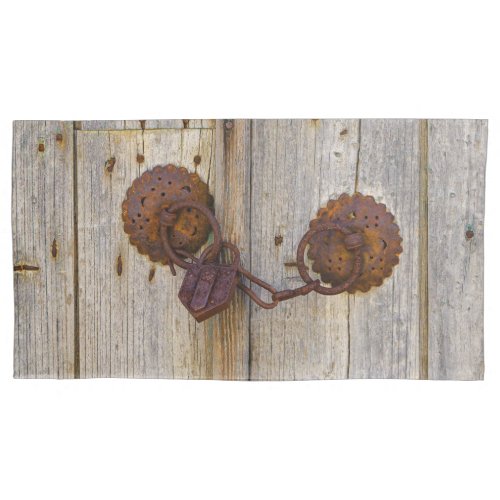 Rusty vintage old iron padlock on a wooden door _ pillow case