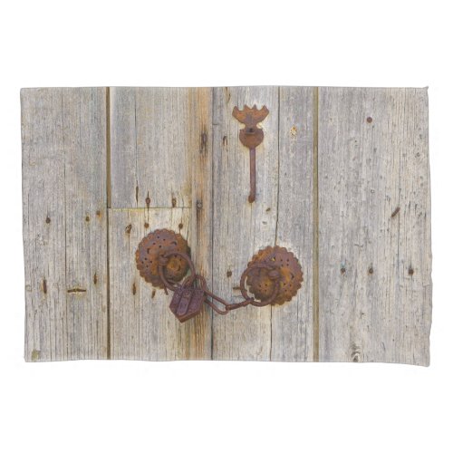 Rusty vintage old iron padlock on a wooden door _ pillow case