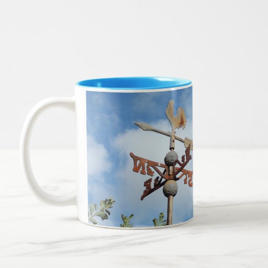 Rusty Weathervane against blue sky Two-Tone Coffee Mug