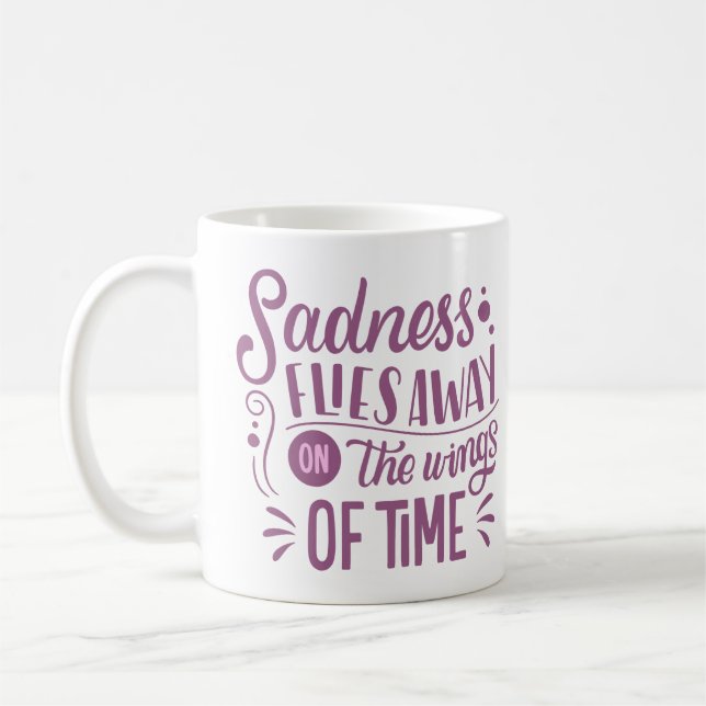 SADNESS FLIES AWAY ON THE WINGS OF TIME COFFEE MUG (Left)