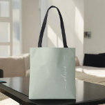 Sage Green Minimalist Modern Monogram Elegant Tote Bag<br><div class="desc">Introducing our Sage Green Minimalist Modern Monogram Elegant Collection: Elevate your aesthetic with serene sophistication and timeless elegance. Our collection showcases minimalist designs in a tranquil sage green hue, complemented by refined monograms tailored to your personal style. From polished stationery to versatile accessories, each piece in our collection is meticulously...</div>