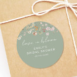 Sage Green Wildflower Bridal Shower Love In Bloom Classic Round Sticker<br><div class="desc">Express gratitude with our Wildflower Thank You Bridal Shower In Bloom Classic Round Sticker. These charming stickers feature a delightful wildflower design, infusing a touch of natural beauty into your bridal shower thank-you notes or favors. The classic round shape adds versatility, making them perfect for various uses, from sealing envelopes...</div>