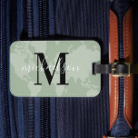 Sage Green World Map Script Monogram Luggage Tag<br><div class="desc">A calming sage green luggage tag featuring a tonal world map silhouette, bold serif initial, and graceful script last name. This earthy monogram design is a stylish way to identify bags while showing off a love of travel. Personalize the initial and name for a gift any globe trotter would appreciate....</div>