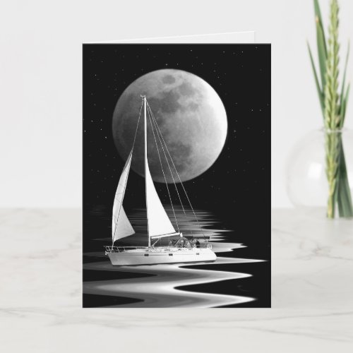Sailboat sailing on moonlit water card