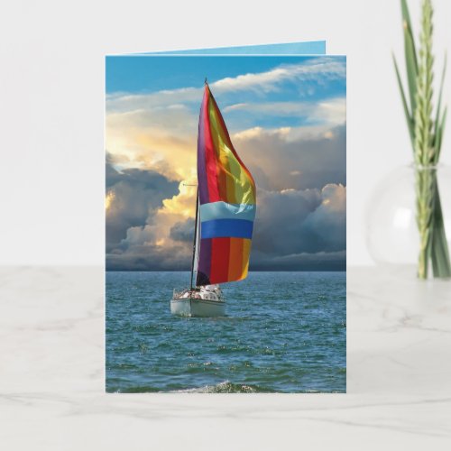 sailboat with rainbow spinnaker on water card