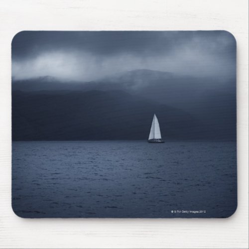 Sailing boat in stormy weather in Scottish Mouse Pad
