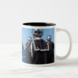 Sailors fire a gun salute during a burial-at-se Two-Tone coffee mug