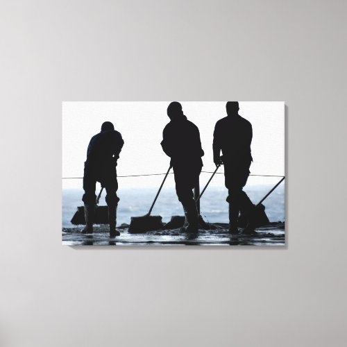 Sailors sweep out the hangar bay canvas print