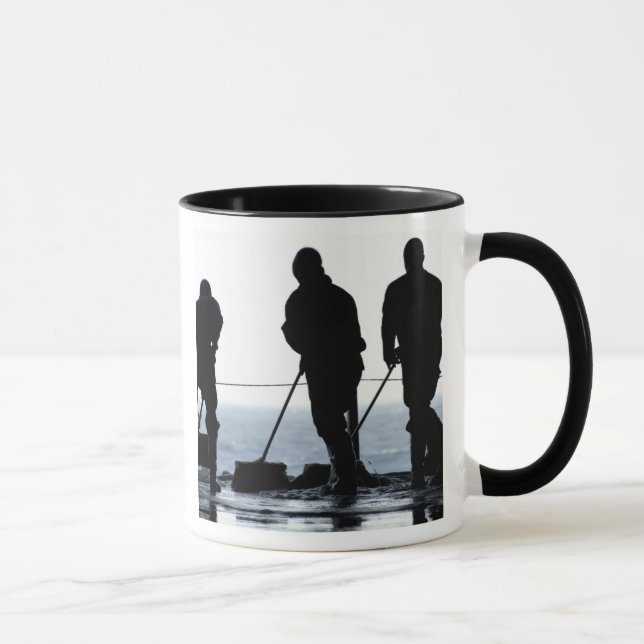 Sailors sweep out the hangar bay mug (Right)