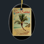 San Cristobal Palm Tree Vintage Travel Ceramic Ornament<br><div class="desc">A uniquely retro mid-century modern San Cristobal Dominican Republic art print in vintage travel poster style. It features a curved palm tree on sandy beach with ocean under a blue cloudy sky.</div>