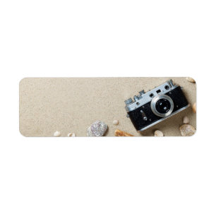 Sand Background. Concept With Old Retro Camera Label