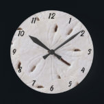 Sand Dollar Beach Seashells Shell Beach Decor Round Clock<br><div class="desc">Designed with image of sand dollar patterns in the background,  this is perfect for beach house decor or Christmas,  holiday gifts!</div>