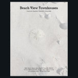 Sand Dollar on Beach Office Letterhead Paper<br><div class="desc">Sand dollar and beach sand letterhead stationery for a seaside office or business. Customize black printed text in three places, with company name, owner / manager name, and address, contact at bottom, or delete as needed. Background image is a little sand dollar partially covered in drifting sand, with a scattering...</div>