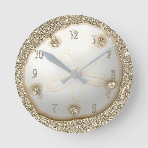 Sand dollar on sparkly gold beach sand round clock
