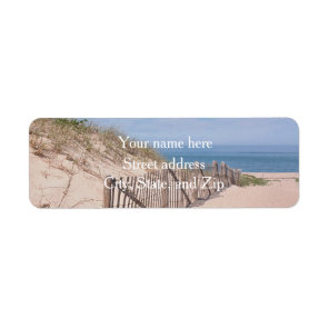 Sand dunes and beach fence label