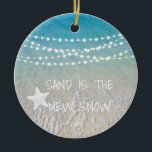 Sand Is The New Snow Beach Christmas Ornament<br><div class="desc">This fun beach living design Sand is the new snow ornament features a beach scene with a sea-star and string lights handing across the top. Personalize by adding a year.</div>