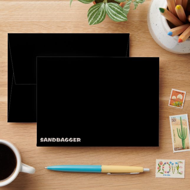 Sandbagger black small envelopes front (Desk)