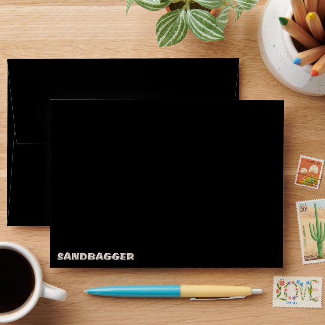 Sandbagger black standard envelopes front (Desk)