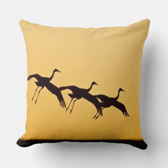 Sandhill Crane landing at sunset Throw Pillow (Front)