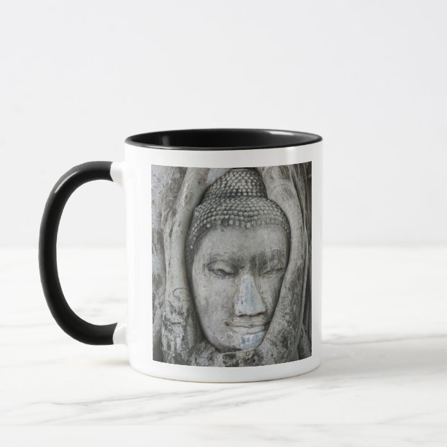 Sandstone head of Buddha surrounded by tree Mug (Left)