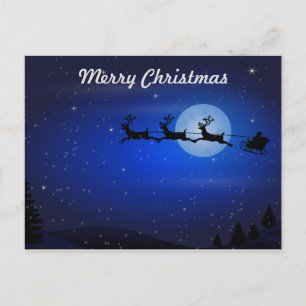 Santa and his reindeers flying at night holiday postcard