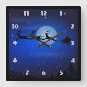 Santa and his reindeers flying at night square wall clock