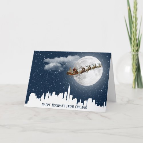 Santa and Sleigh Flying Over Big City Skyline  Card