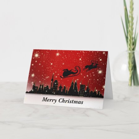 Santa And Sleigh Over Large City Holiday Card