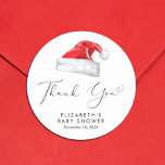 Santa Baby Christmas Baby Shower Thank You Classic Round Sticker<br><div class="desc">Cute stickers for your Christmas holiday season baby shower correspondence and party favors with "Thank You" in an elegant script with a heart swash and a watercolor illustration of a red Santa Claus hat. Personalize with the mother's name and shower date in simple modern typography.</div>