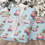 Santa Beach Christmas Wrapping Paper<br><div class="desc">Get into the holiday spirit with this unique Christmas wrapping paper featuring a relaxed Santa Claus in sunglasses lounging in a pink flamingo floaty in the ocean. Perfect for wrapping gifts with beachy holiday vibes, this paper is ideal for anyone living in tropical places like Florida, Hawaii, or the Bahamas,...</div>