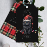 Santa Cat Kitten Christmas Red and Plaid Gift Tags<br><div class="desc">This dark and whimsical gift tag combines the charm of a black kitten with the festive spirit of Christmas. The front of the tag features a sleek black background that serves as a dramatic canvas for the design. At the center of the tag, a playful black kitten steals the show....</div>