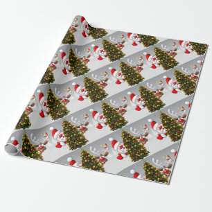 Santa claus and reindeer behind a christmas tree.j wrapping paper