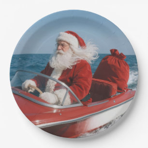 Santa Claus Delivering Gifts By Speedboat Paper Plates