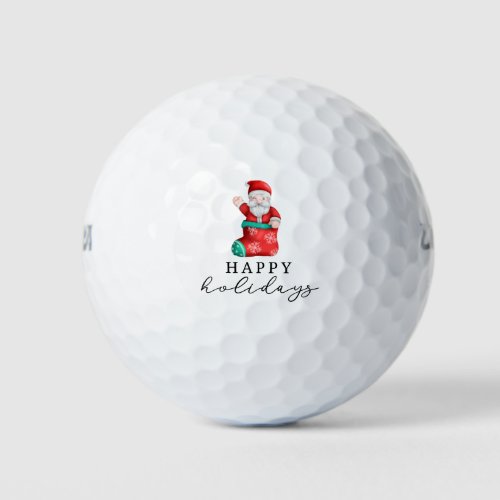Santa Claus is golfing on Christmas Happy Holidays Golf Balls