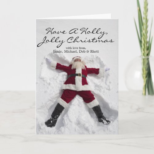 Santa Claus making snow angel billboard Holiday Card