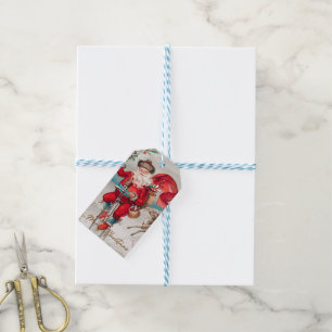 Santa Claus on a penny farthing with reindeer Gi Gift Tags