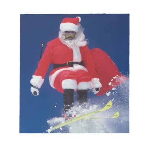 Santa Claus on skis jumping off a cornice at Notepad