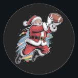 Santa Claus Playing American Football Christmas  Classic Round Sticker<br><div class="desc">Santa Claus Playing American Football Christmas Football Fan</div>