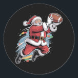 Santa Claus Playing American Football Christmas  Classic Round Sticker<br><div class="desc">Santa Claus Playing American Football Christmas Football Fan</div>