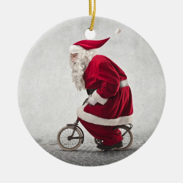 Santa Claus Rides A Bicycle Ceramic Ornament (Front)