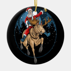 SANTA CLAUS RIDING A CHRISTMAS REINDEER CERAMIC ORNAMENT
