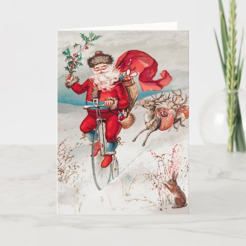 Santa Claus Riding Bicycle Reindeer and Rabbit Holiday Card
